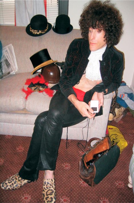 Guitarist Craig Ross relaxes backstage wearing custom-made black Lost Art Leather Pants