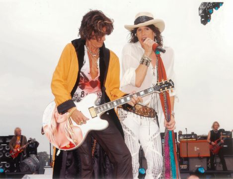 Guitarist Joe Perry of the Rock band Aerosmith wears a custom-made Lost Art: Leather Coat, Leather Pants with a Leather Belt