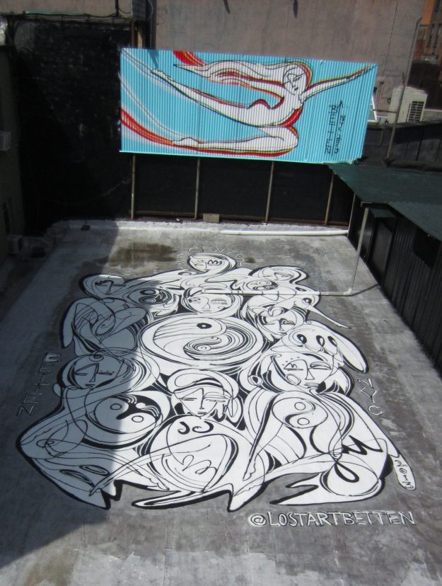 Lady Luck - An Urban Art mural spray painted by Jordan Betten on the roof of a building, view able from The High Line park in New York City circa 2013
