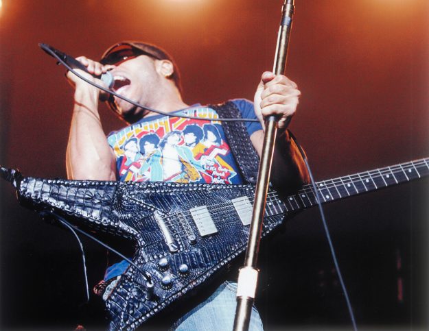 Lenny Kravitz plays a Gibson Flying V guitar that is covered with custom-made Lost Art™ Alligator cover
