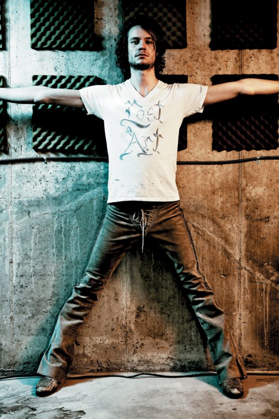 Male model wears hand-made Lost Art™ Leather Pants with Rattlesnake detail and a Cotton Lost Art T-shirt