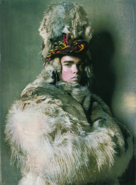 Male Model wears a custom-made Lost Art Fur Shawl with a Hood and Lost Art Leather Pants with Leather Laces in Vogue Italia Fall 2005