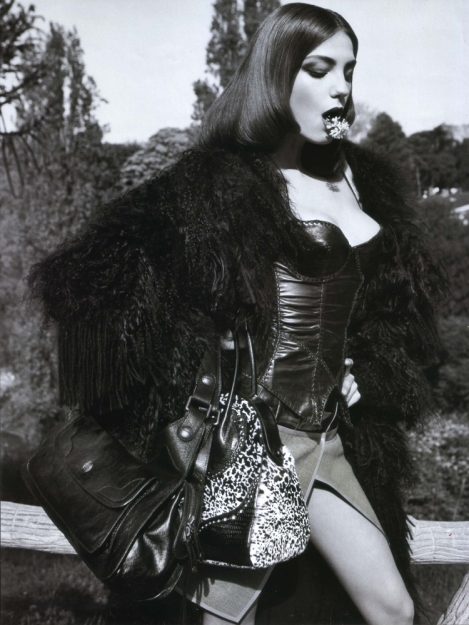 Model Daria Werbowy with a Flower in her mouth, wears a custom-made Black Lost Art Leather Corset by Jordan Betten in Vogue Paris Magazine circa 2006