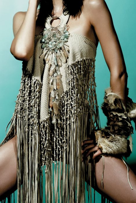 Model Elise Crombez wears handmade Lost Art™ clothing and accessories: a leather woven shawl with leather fringe, a crystal necklace made of quartz and aquamarine and adorns a fur armband