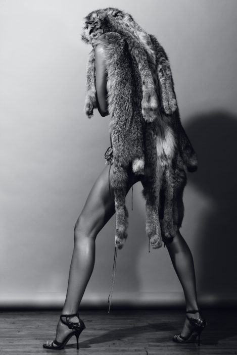 Model Elise Crombez wears a handmade Lost Art™ lynx fur shawl and is wearing black high heel shoes
