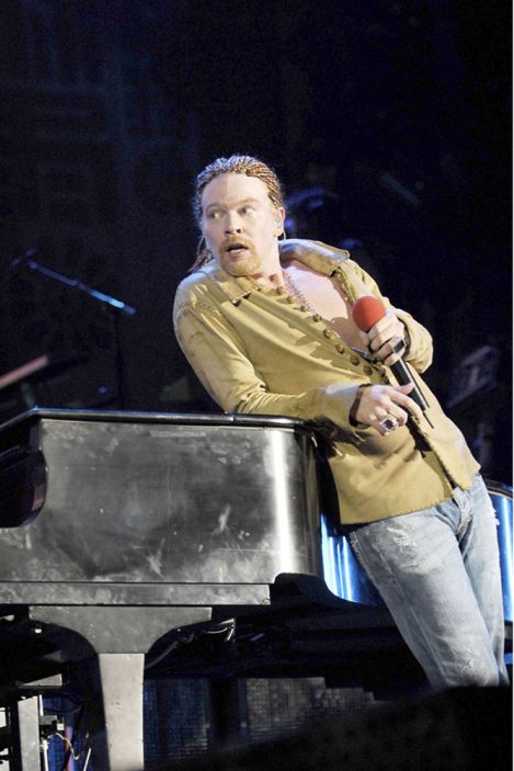 Singer-songwriter Axl Rose of the rock band Guns N' Roses, wears a custom-made 13-button Leather shirt by Lost Art, while performing at Actress Rosario Dawson's birthday party