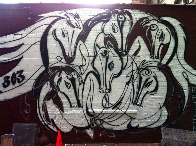 Suite 303 - An Urban Art Mural by Jordan Betten and Artist Sue Bae, spray painted horses outside the Beauty Salon Suite 303 in New York City circa 2013