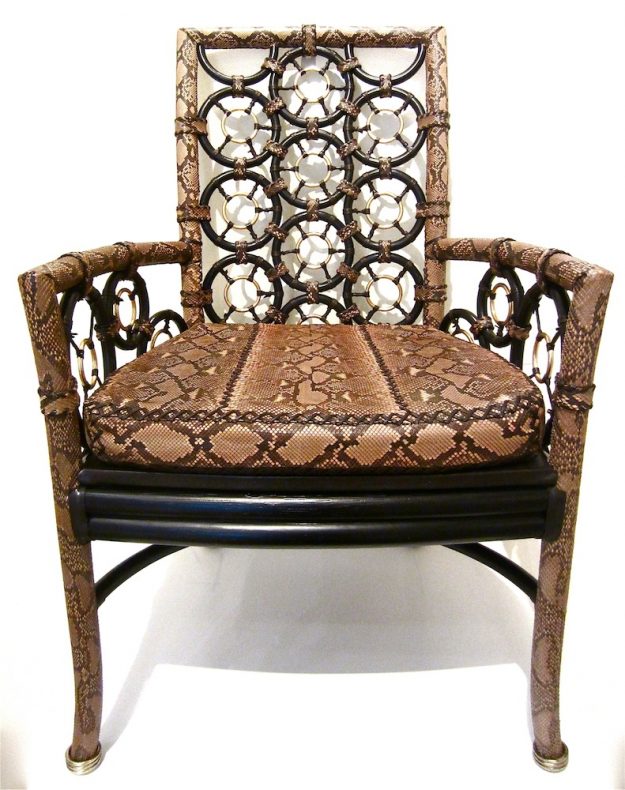 Lost Art hand-made chair covered in Python skin and a Python skin covered seat cushion and metallic silver rings leg tips